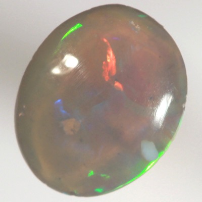 SOLID CRYSTAL OPAL Bright rolling flashes, green and yellow